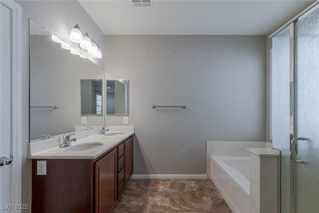 bathroom with vanity and a bath