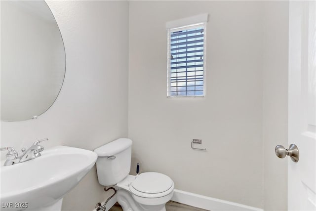 bathroom with sink and toilet