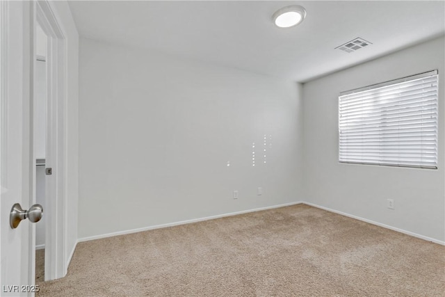 empty room with light colored carpet