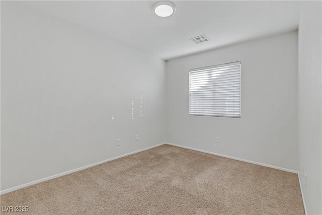 spare room with light colored carpet