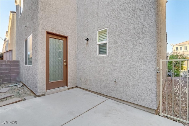 doorway to property with a patio area