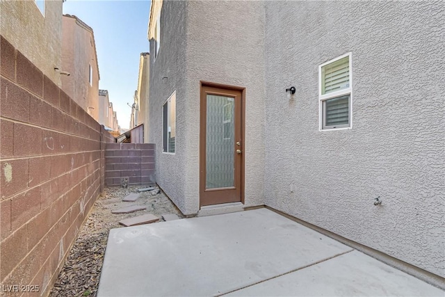 property entrance with a patio