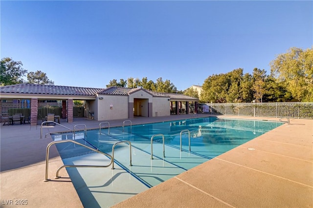 view of swimming pool featuring a patio