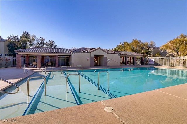 view of swimming pool with a patio