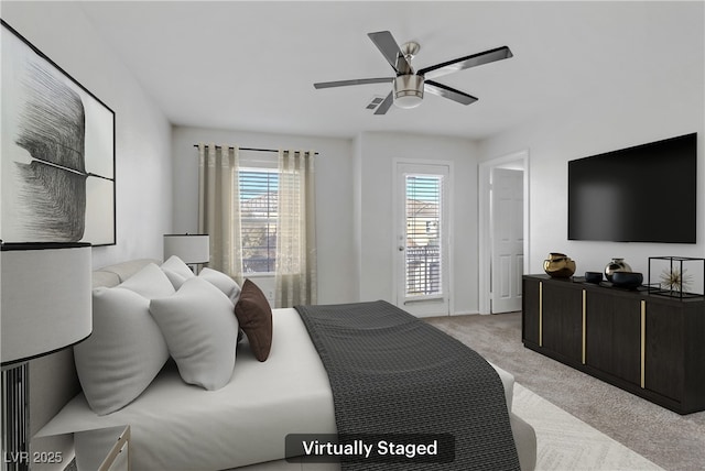 bedroom with light colored carpet and ceiling fan