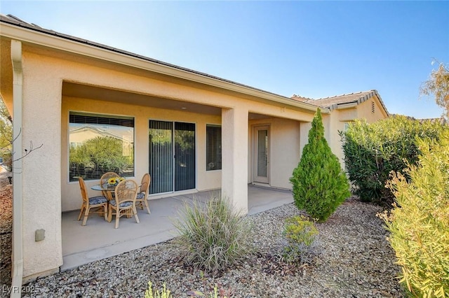 rear view of house featuring a patio area