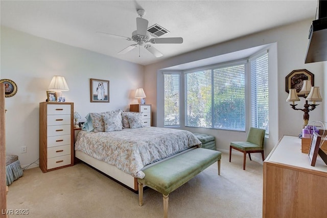 bedroom featuring light carpet and ceiling fan