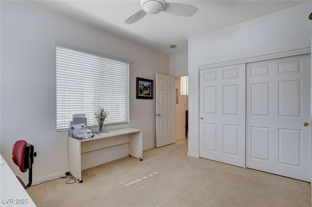 carpeted bedroom with a closet and ceiling fan