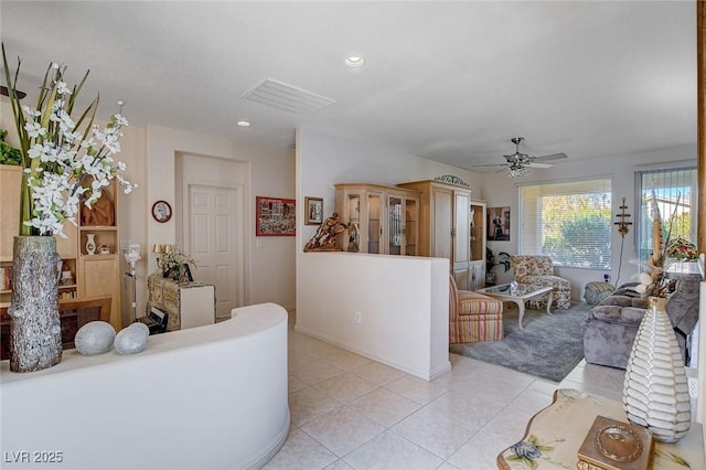 living room with light tile patterned floors and ceiling fan