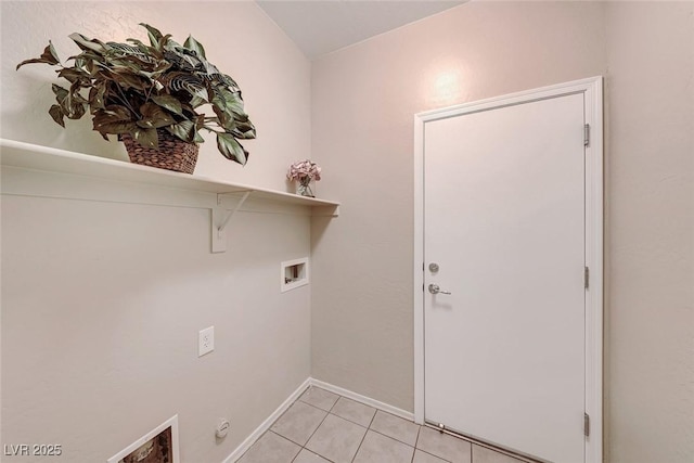 washroom with laundry area, baseboards, light tile patterned floors, and washer hookup