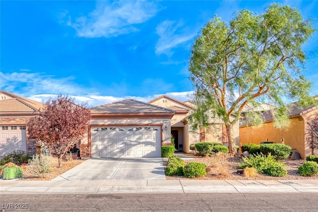 ranch-style home featuring a garage, driveway, a tile roof, and stucco siding