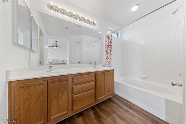 bathroom featuring ceiling fan, shower / tub combo with curtain, vanity, and hardwood / wood-style floors