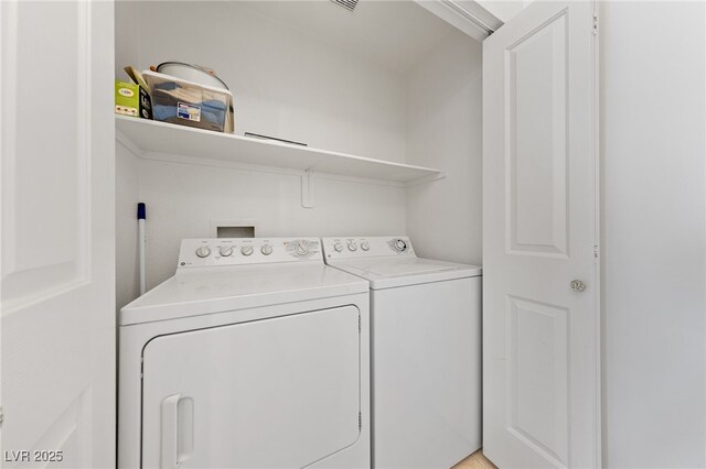 washroom featuring separate washer and dryer