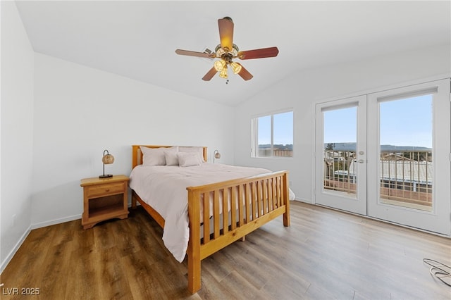 bedroom featuring ceiling fan, vaulted ceiling, hardwood / wood-style floors, and access to outside