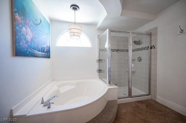 bathroom featuring tile patterned flooring and shower with separate bathtub