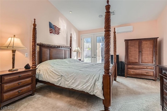 bedroom with access to exterior, light colored carpet, french doors, and a wall mounted AC