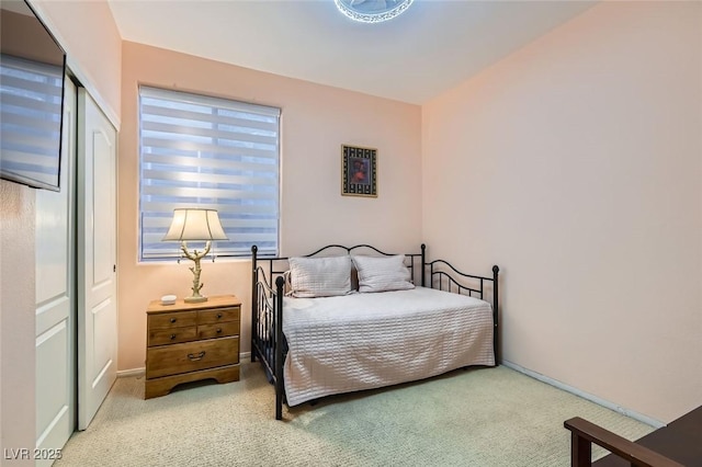 carpeted bedroom featuring a closet