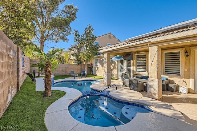 view of pool with an in ground hot tub, an outdoor living space, and a patio area