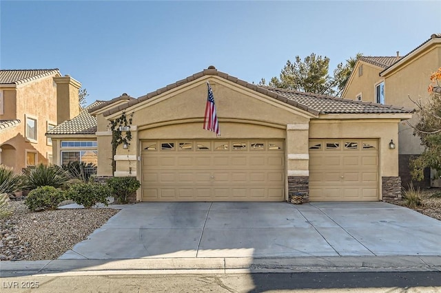 mediterranean / spanish-style house with a garage