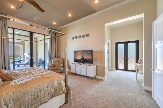 bedroom featuring light carpet, access to exterior, and french doors