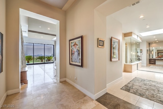 hallway with light tile patterned floors