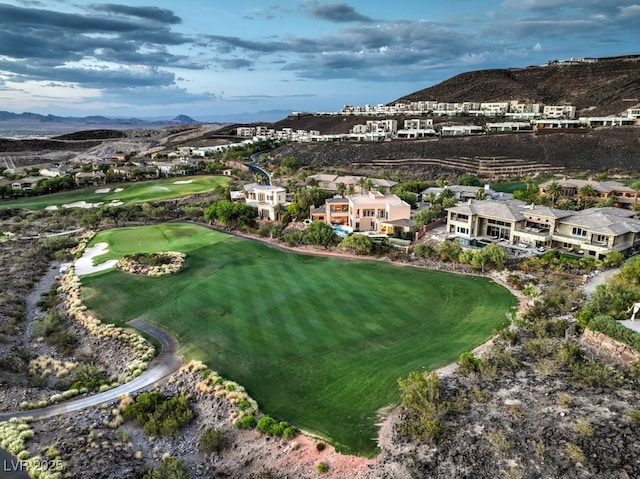 birds eye view of property with a mountain view