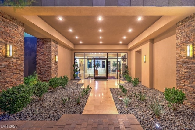 doorway to property with a patio