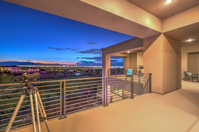 view of balcony at dusk