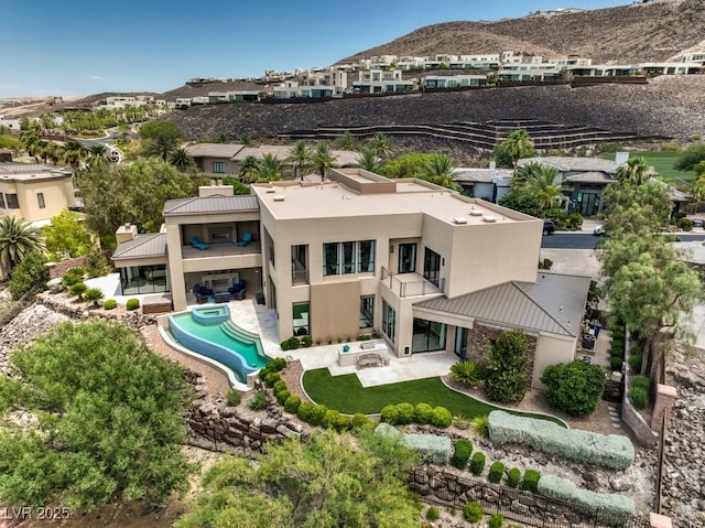 birds eye view of property with a mountain view