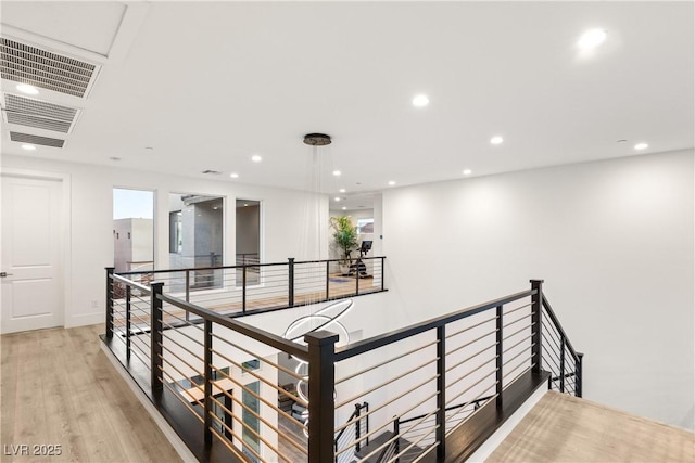 corridor featuring light hardwood / wood-style floors