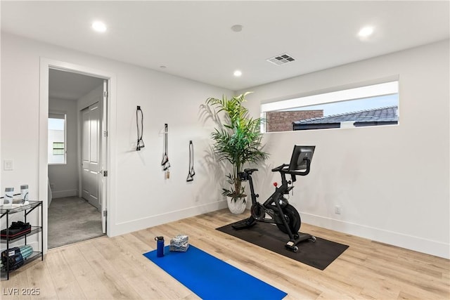 workout room with hardwood / wood-style floors