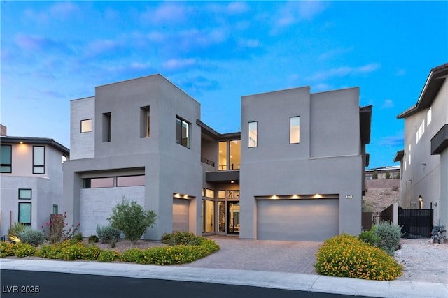 modern home with a garage and cooling unit