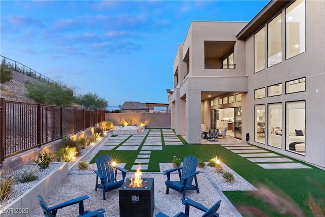 exterior space featuring a patio and an outdoor fire pit