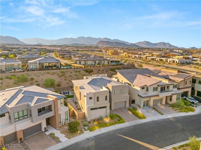 birds eye view of property with a mountain view