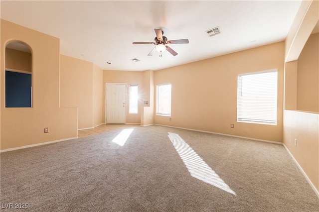 unfurnished room with light carpet and ceiling fan