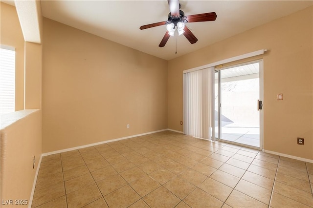 tiled empty room featuring ceiling fan