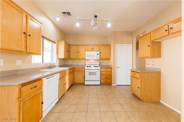 kitchen with sink, white appliances, light tile patterned floors, and light brown cabinets