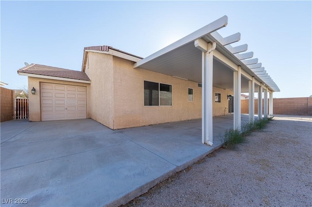 view of side of home with a garage