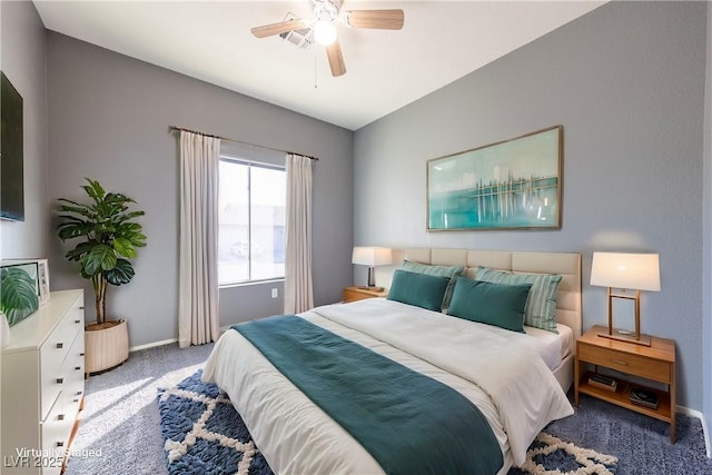 bedroom with ceiling fan and dark carpet