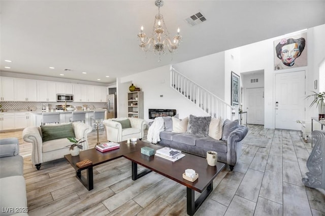 living room with a notable chandelier