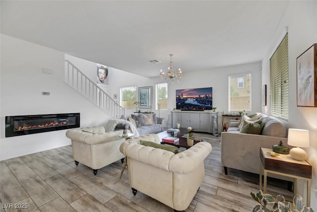 living room featuring an inviting chandelier