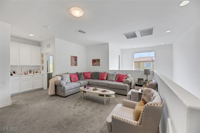 carpeted living room with a healthy amount of sunlight