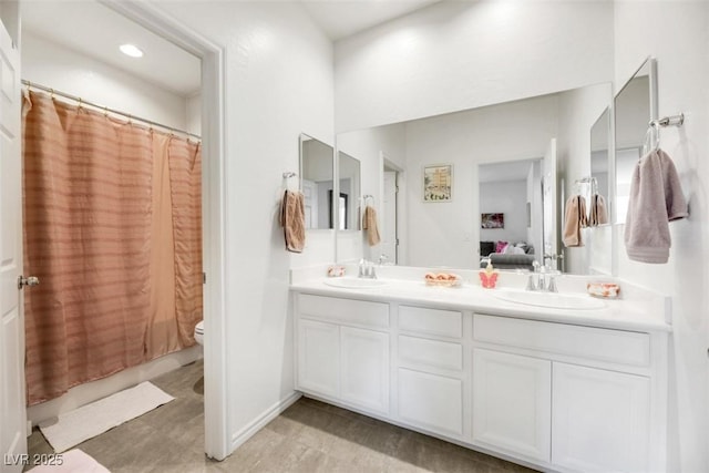 bathroom with vanity and toilet