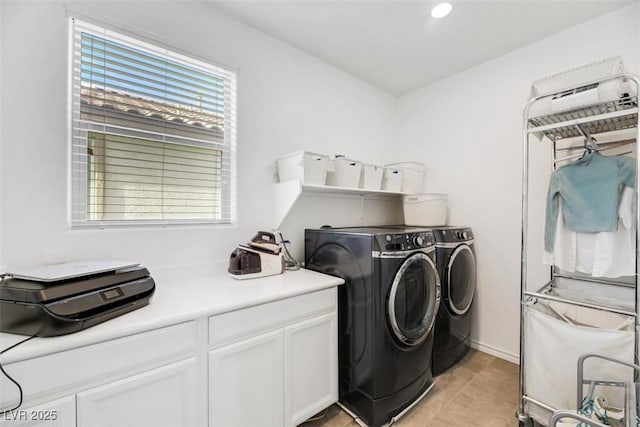 clothes washing area with separate washer and dryer