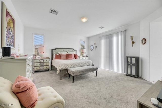 bedroom featuring light carpet