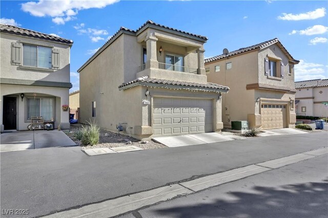 mediterranean / spanish-style house featuring a balcony, a garage, and central AC unit