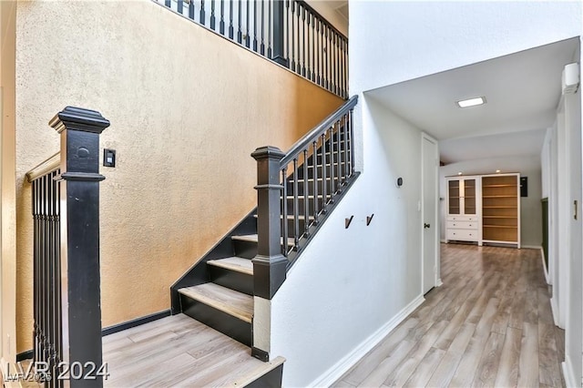 stairway featuring hardwood / wood-style flooring