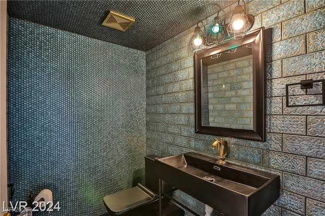 bathroom featuring sink and toilet