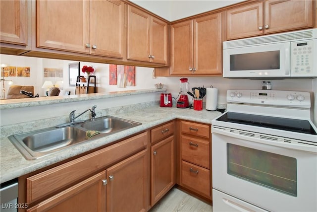 kitchen with sink and white appliances