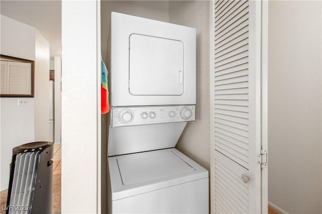 washroom with stacked washer / dryer